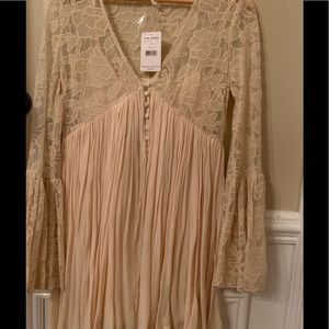 NWT Free People Size small tunic/short dress with lace bell sleeves.